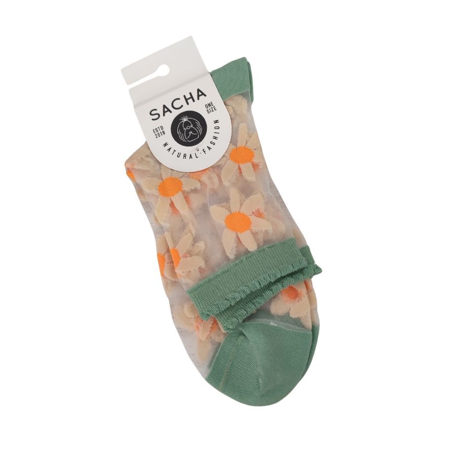 Calcetines Transparentes Fantasia Sacha. Calcetines transparentes de fantasía con delicadas margaritas y puño elástico en verde jade. El complemento floral idóneo para dar la bienvenida al buen tiempo.