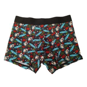 Bóxer Sacha Tiburones Surf. Estampa playera con tiburones surferos y flores de hibiscus sobre un fondo oscuro y veraniego.